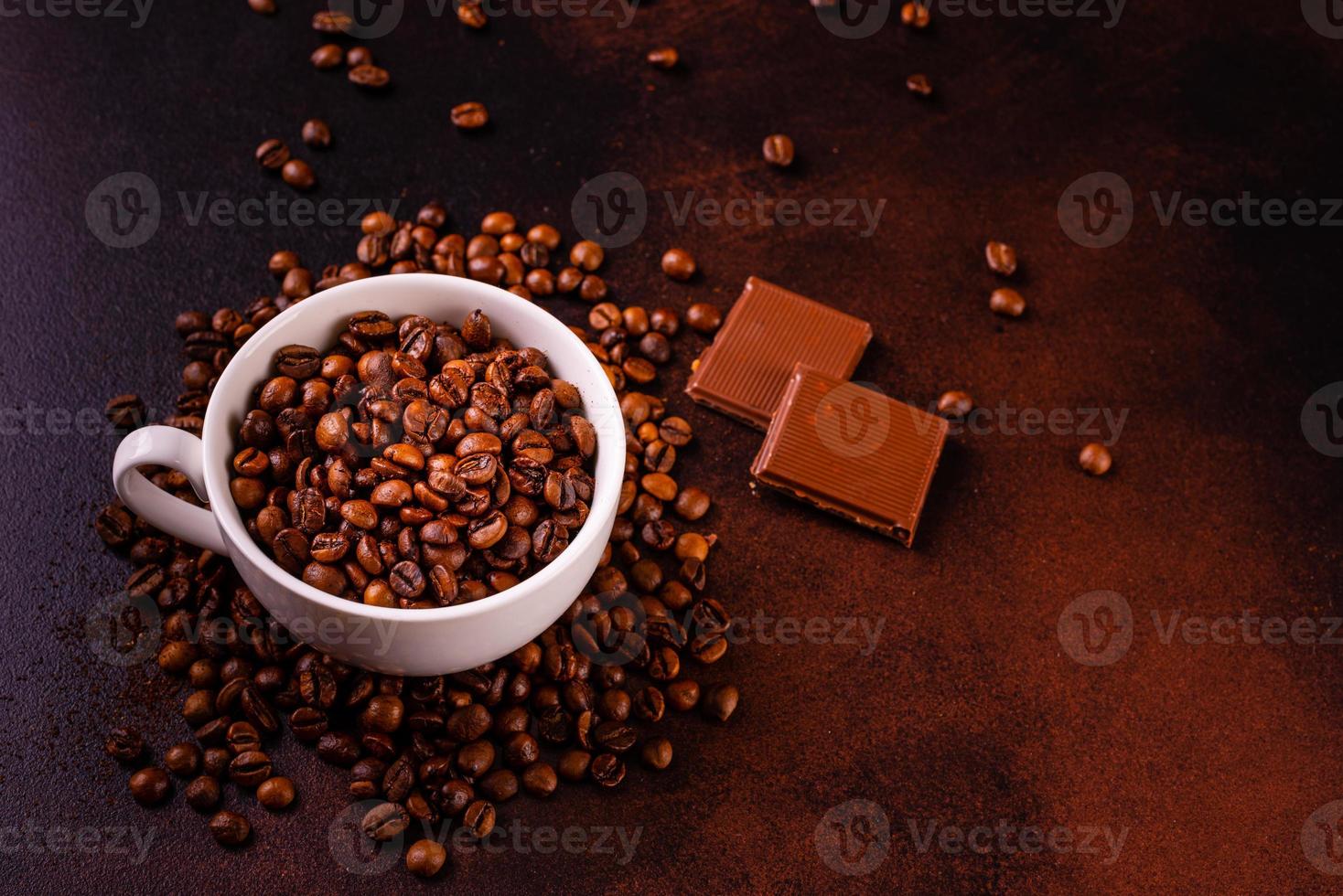 Seeds of fragrant coffee on a dark concrete background photo