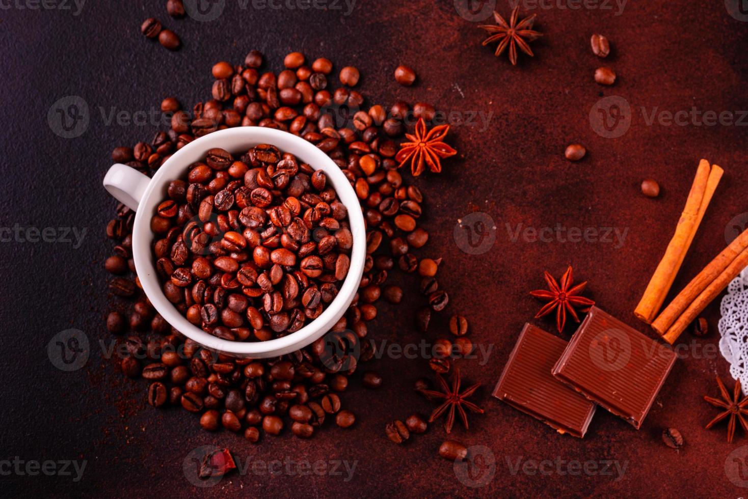 Seeds of fragrant coffee on a dark concrete background photo