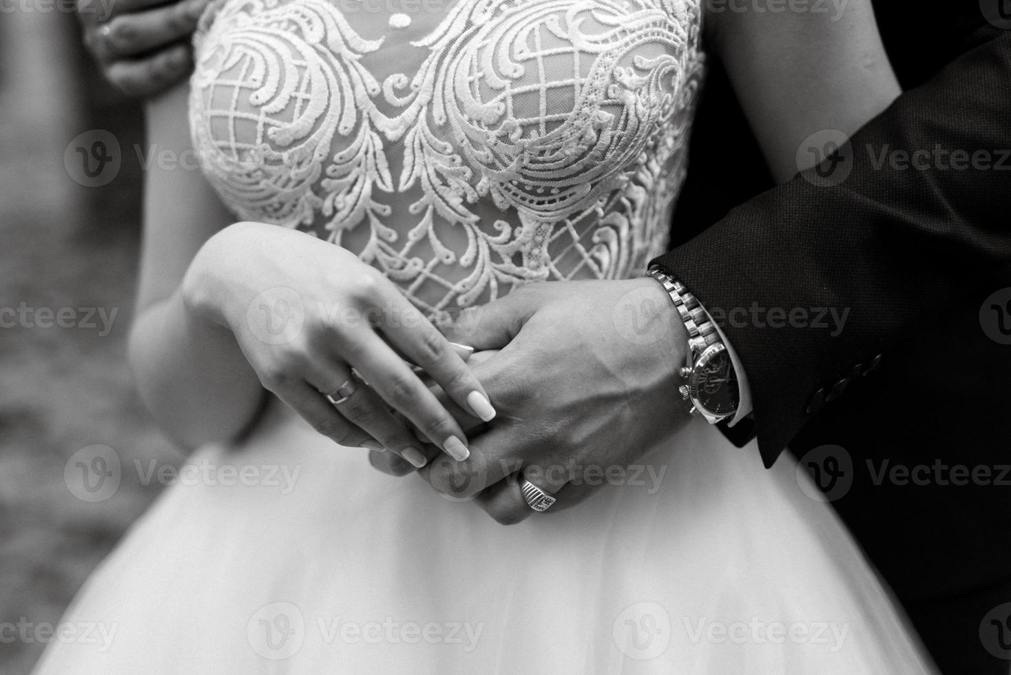 bride and groom held hands photo