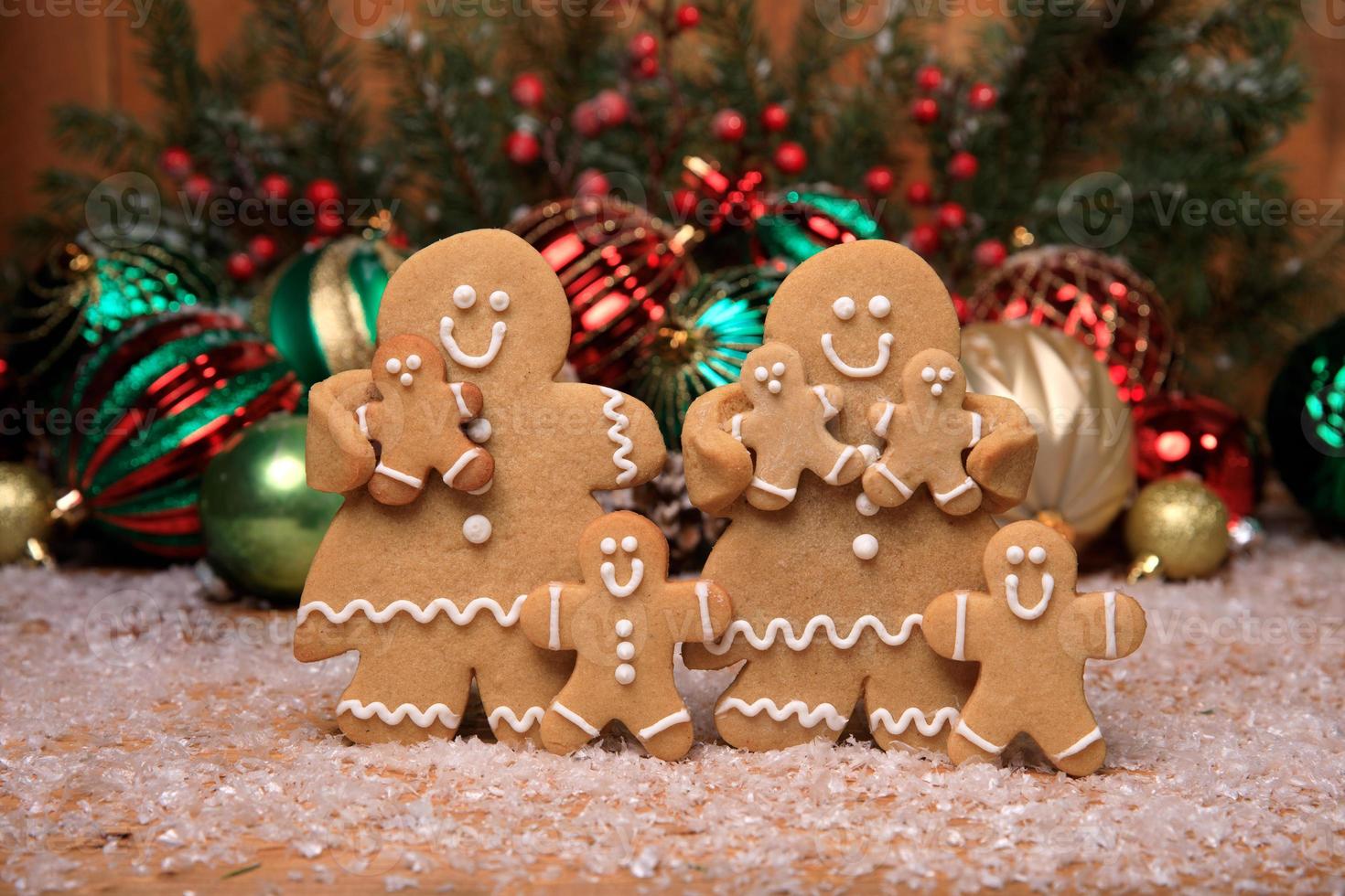 Family of Gingerbreads with 5  kids on Holiday Christmas Background photo