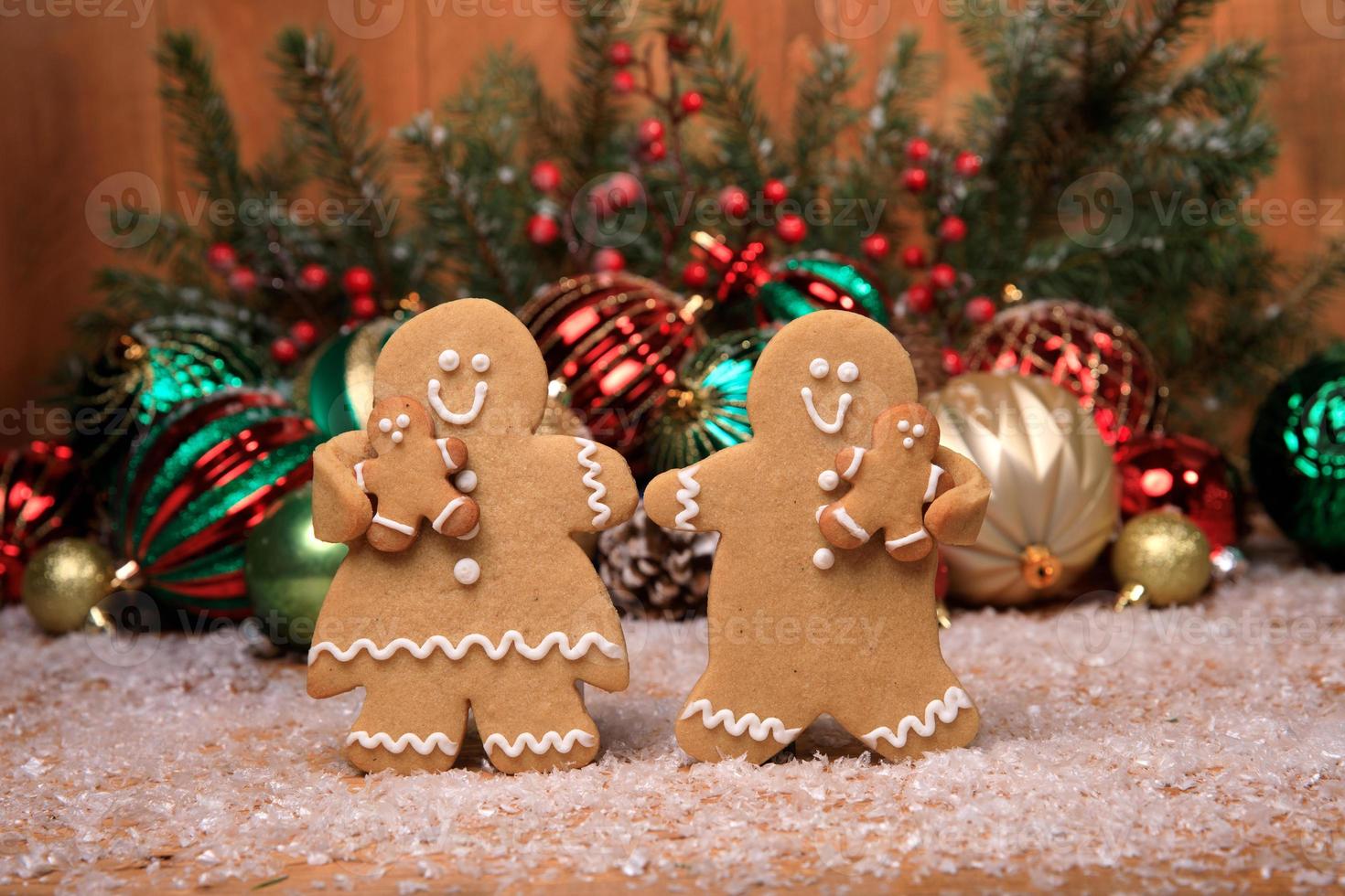 Family of Gingerbreads with 2 kids on Holiday Christmas Background photo