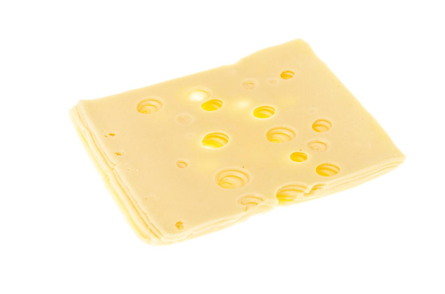 Slices of cheese with holes isolated on white background photo