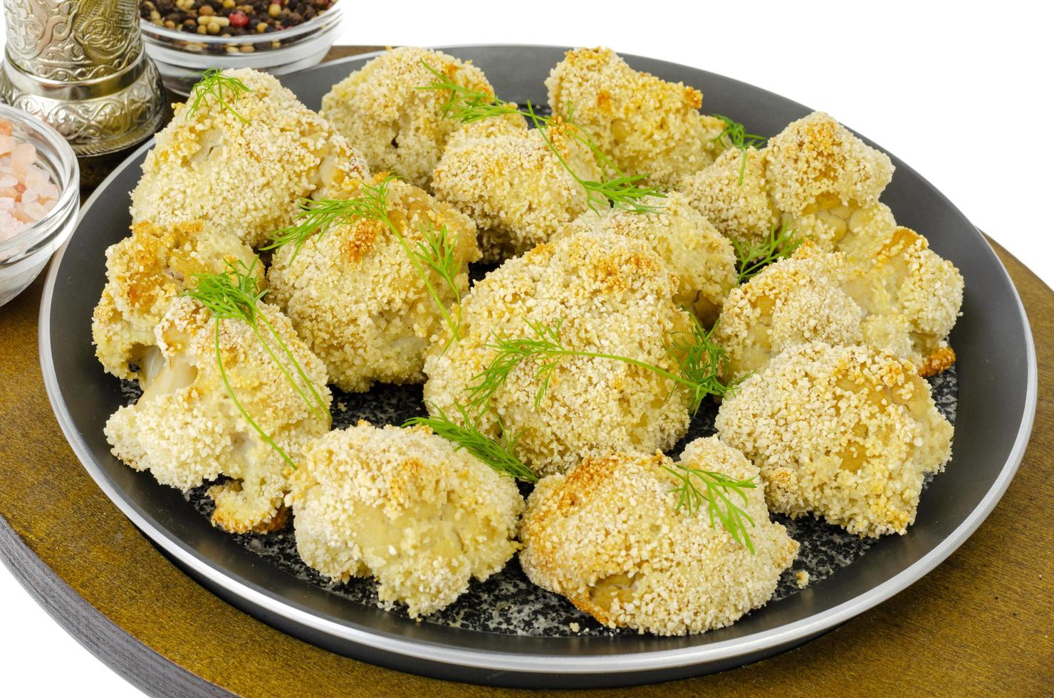 Cauliflower breaded in breadcrumbs in pan. Photo