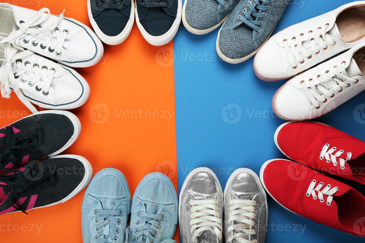 Female stylish shoes on color background, top view photo