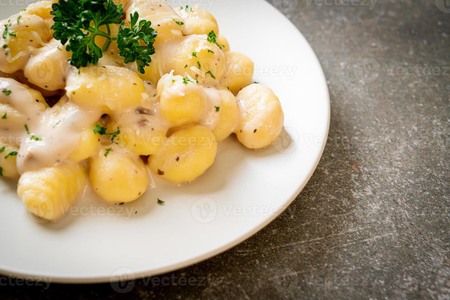 Gnocchi with mushroom cream sauce and cheese photo