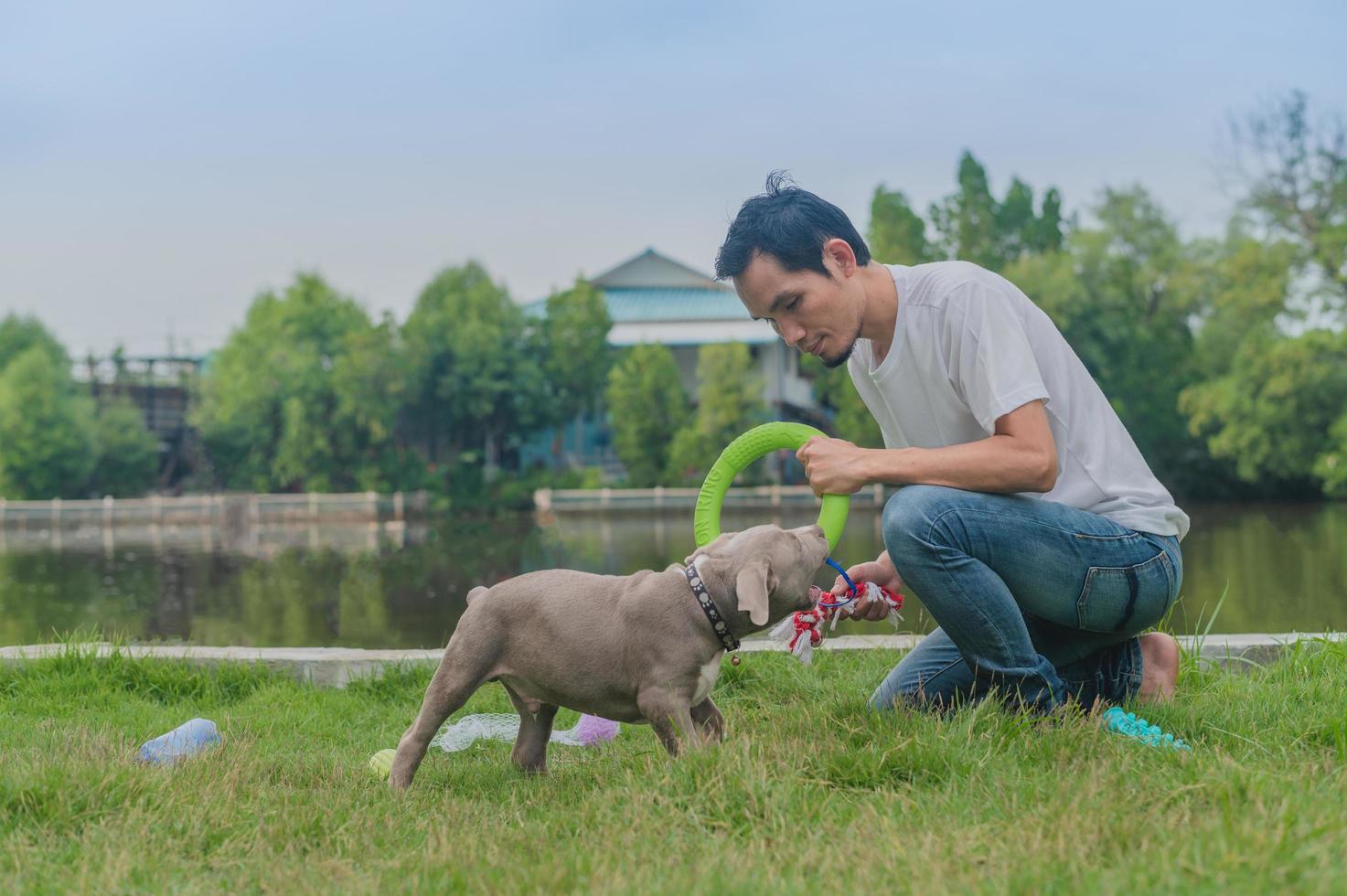Man puppy dog playing happy pet lover photo