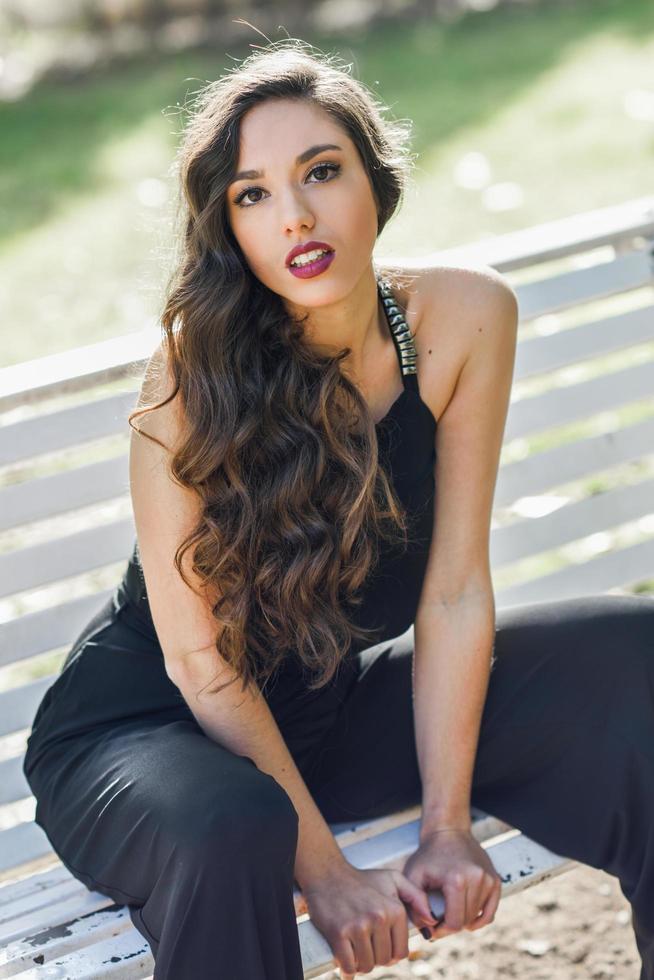 Pretty girl wearing black clothes in a park photo