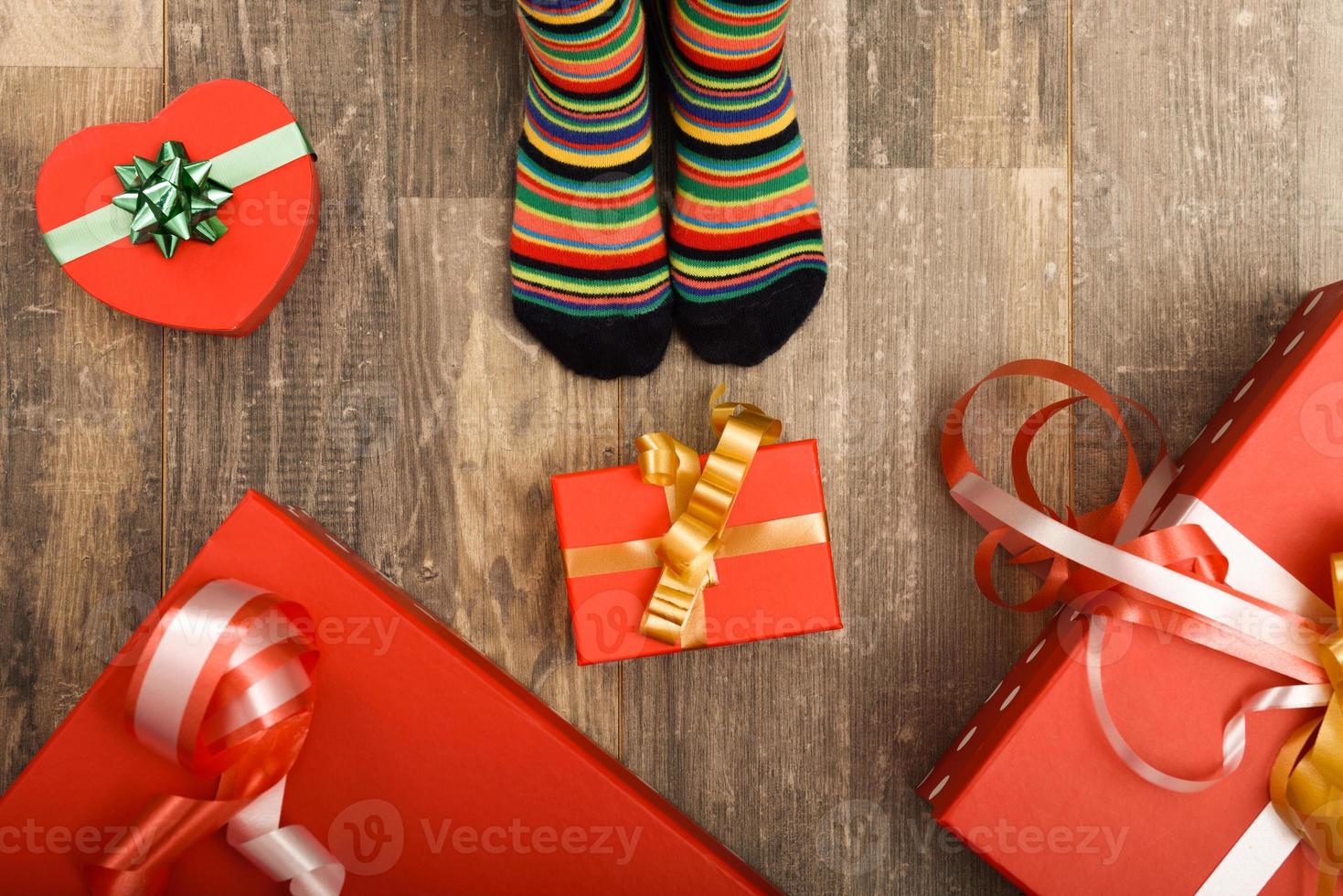 Feet of little children on wood floor photo