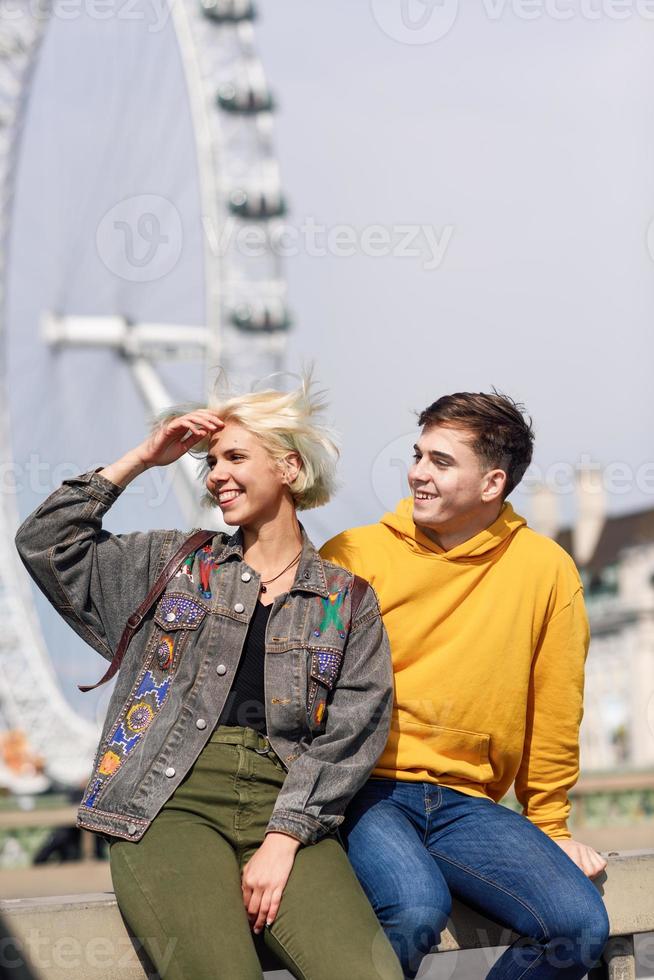 Happy couple by westminster bridge, River Thames, London. UK. photo