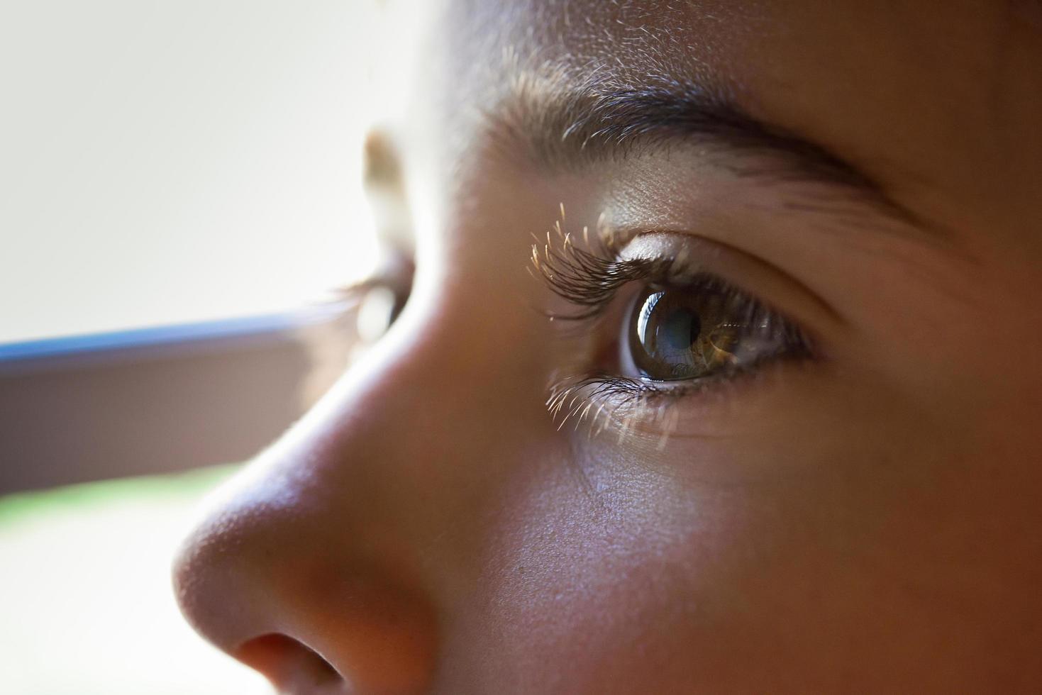 Close-up of beautiful little girl brown eyes photo