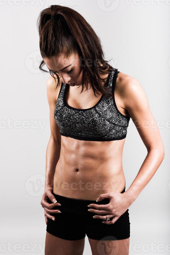 Young sport sexy fitness woman body on white background photo