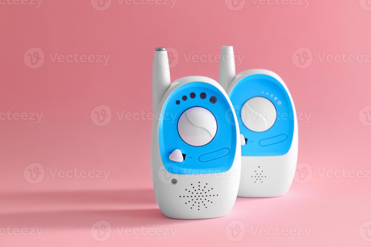 Baby monitor units on color background. Radio nanny photo