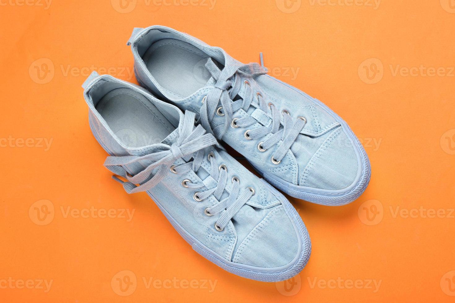 Casual female shoes on color background photo