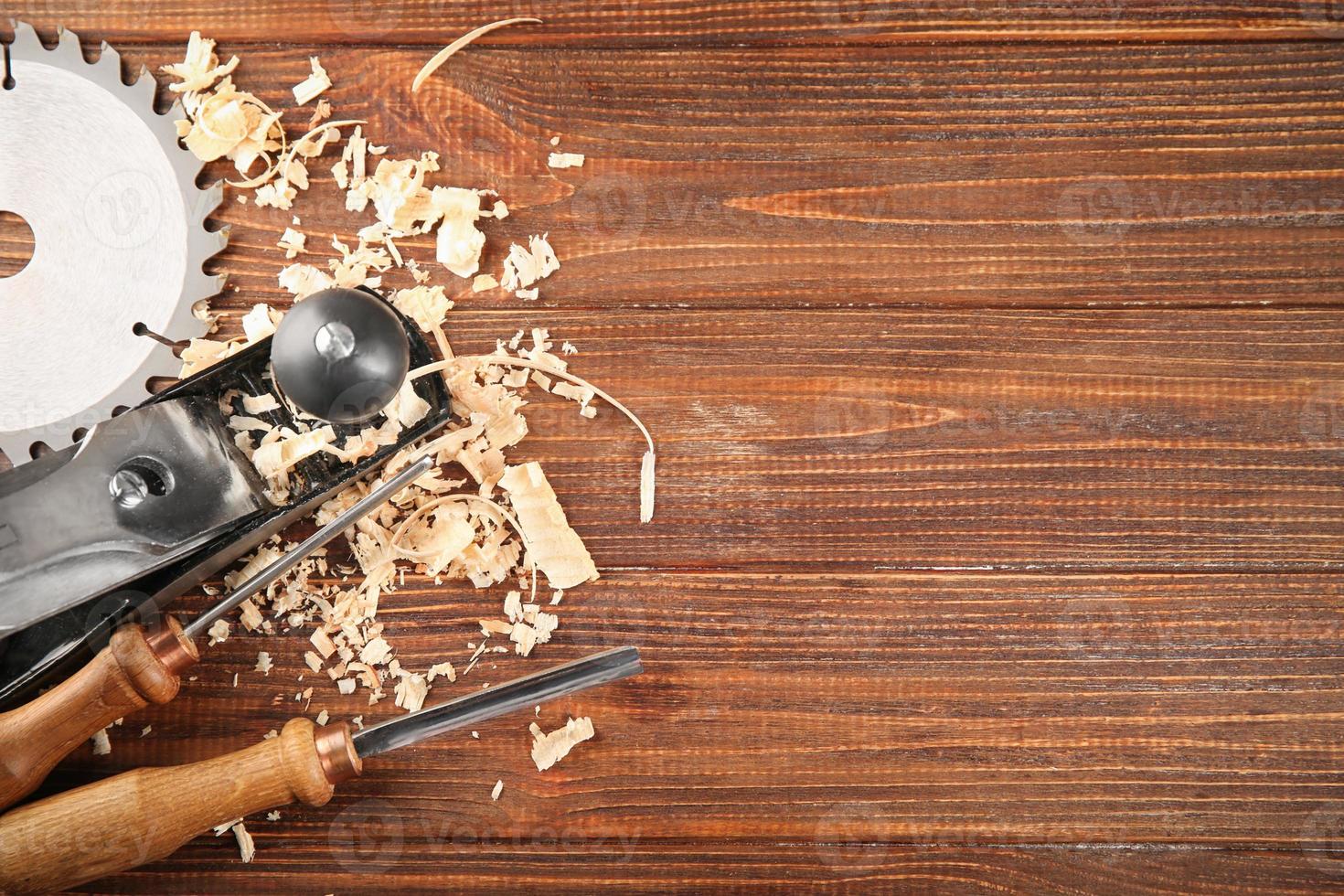 Set of carpenter's tools on wooden background photo