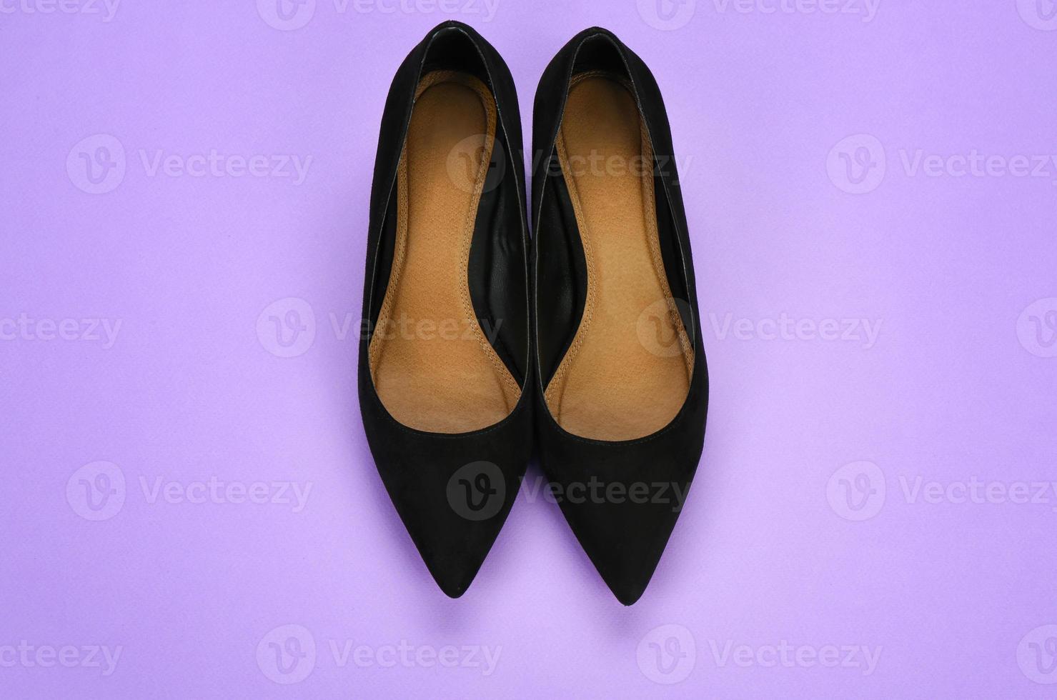 Stylish female shoes on color background photo