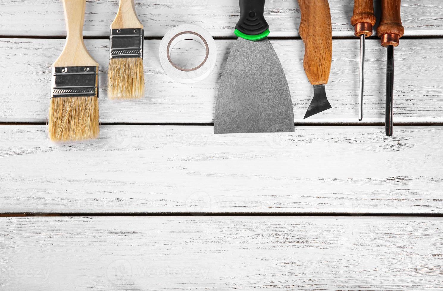 Set of carpenter's tools on wooden background photo