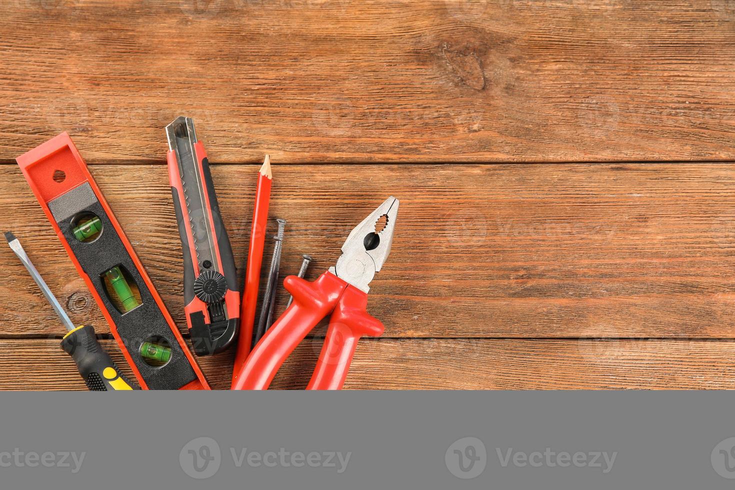 Set of tools on wooden background photo