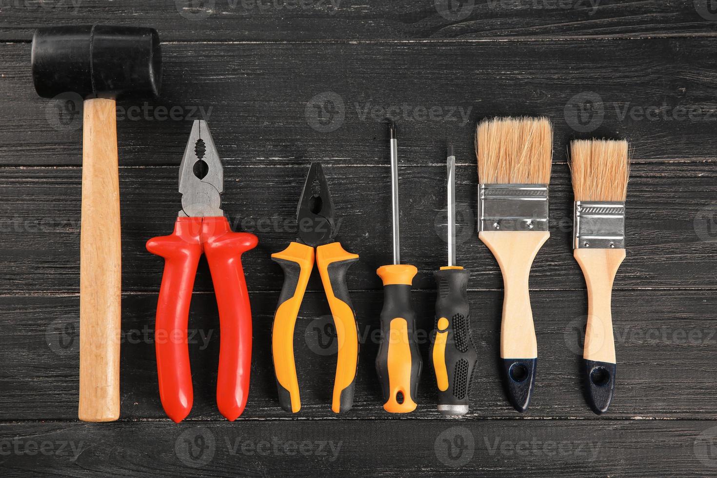 Set of tools on wooden background photo