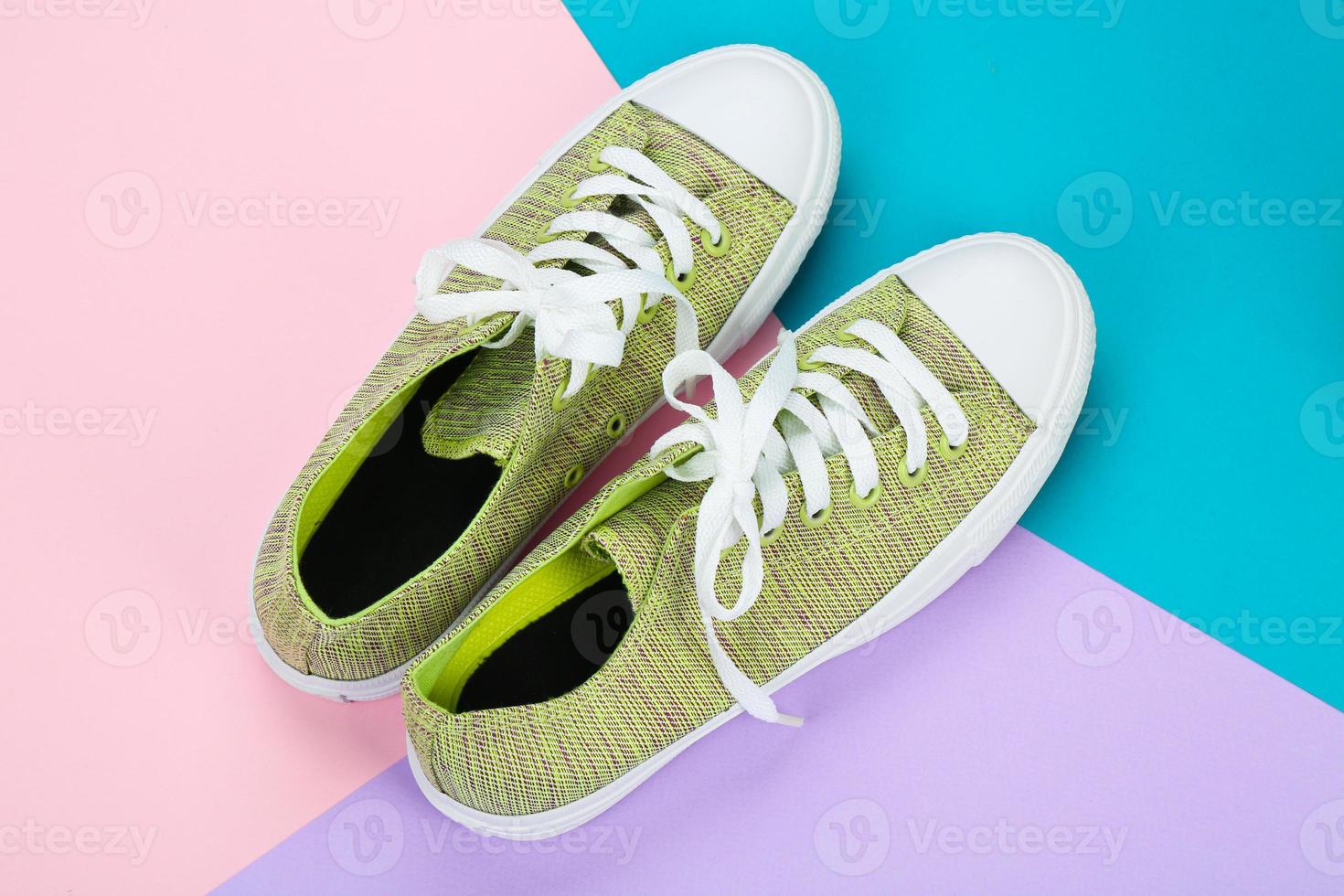 Casual female shoes on color background photo