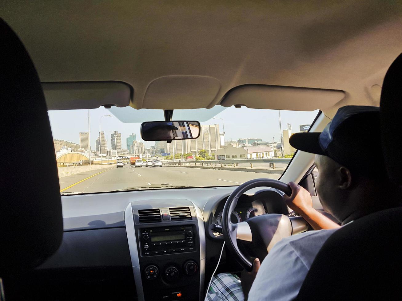 Taxi driver in Cape Town, South Africa. Taxi back seat. photo