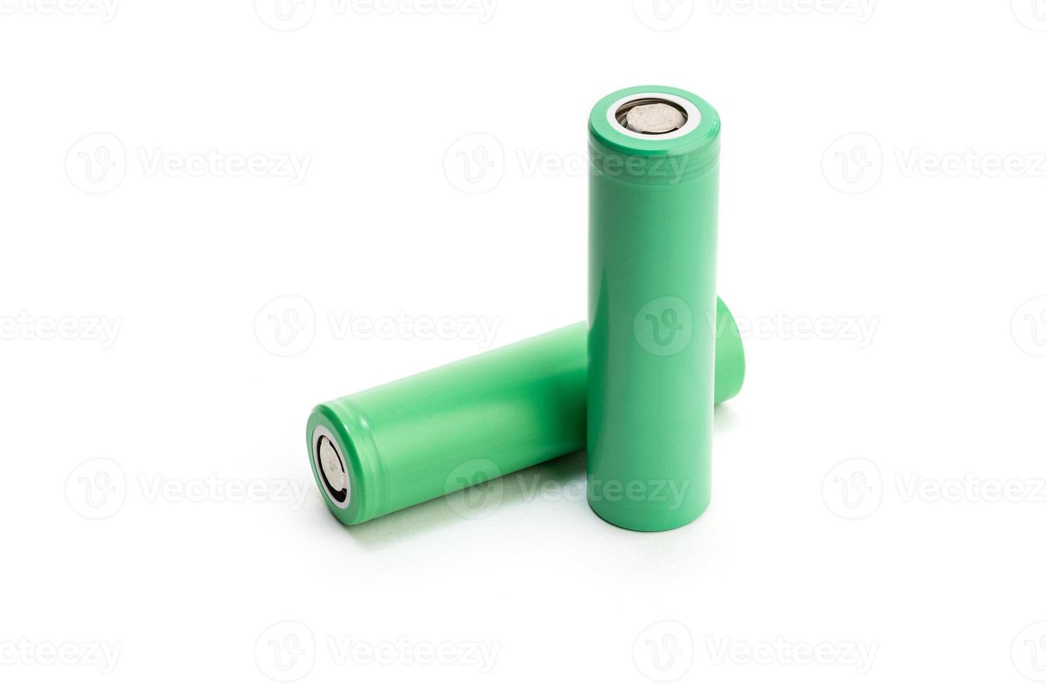 Pair of Green batteries isolated on white background. Blank 18650 Li-ion battery. Copy space photo