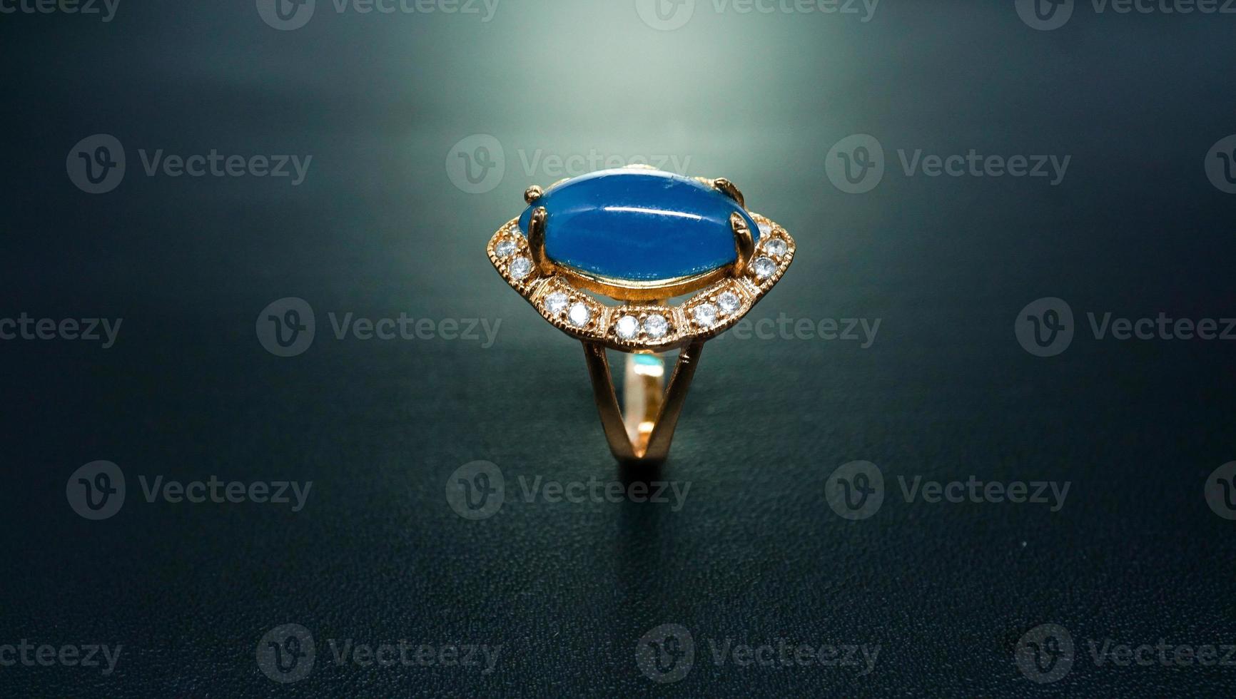 photo of women's ring with a light blue stone motif