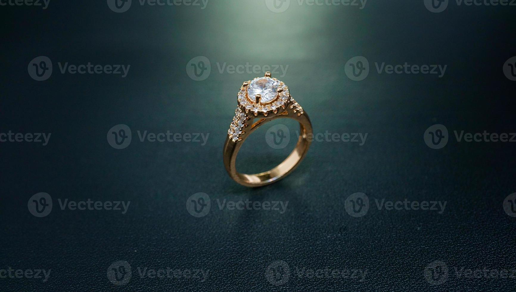 photo of women's ring with gem diamonds on a black background