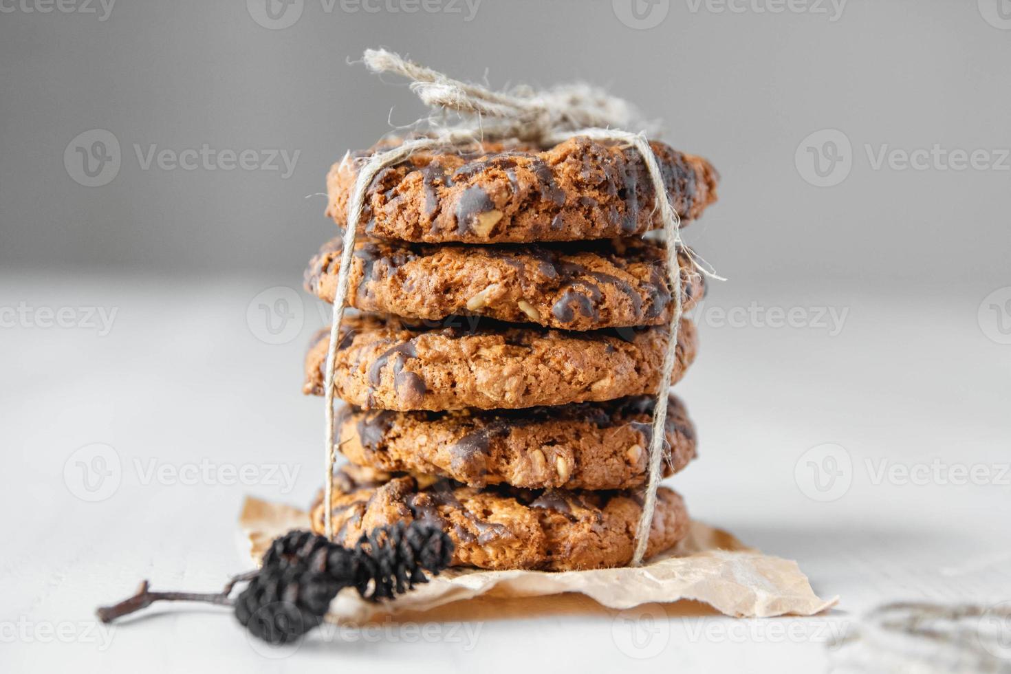 Delicious chocolate chip cookies on white table background photo