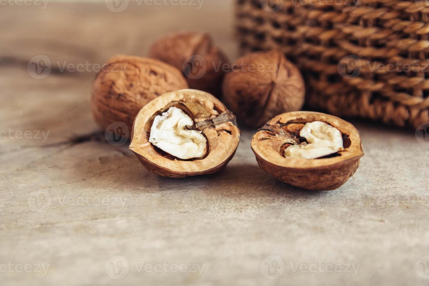 Walnuts on a wooden background photo