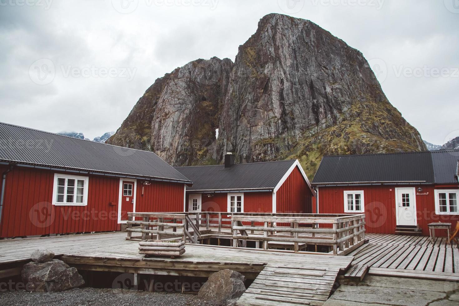 Norway rorbu houses and mountains rocks over fjord landscape scandinavian travel view Lofoten islands. Natural scandinavian landscape. photo