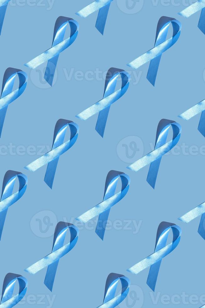 Concept for world diabetes day 14 november. Symbolic color bow to raise awareness on the day of diabetes on a light background. Seamless pattern. Vertical photo