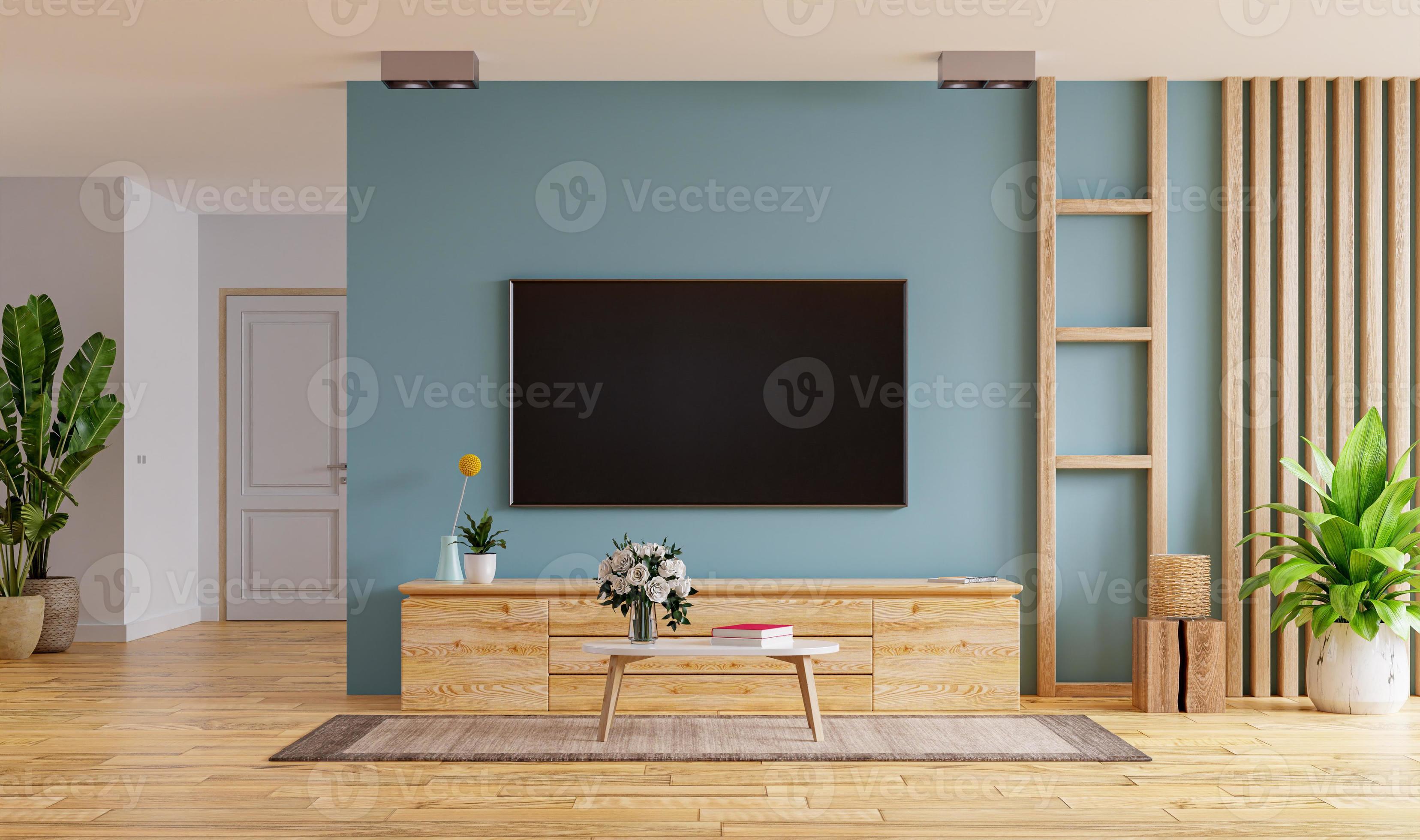 TV LED on the cabinet in modern living room on blue wall background.  4527452 Stock Photo at Vecteezy