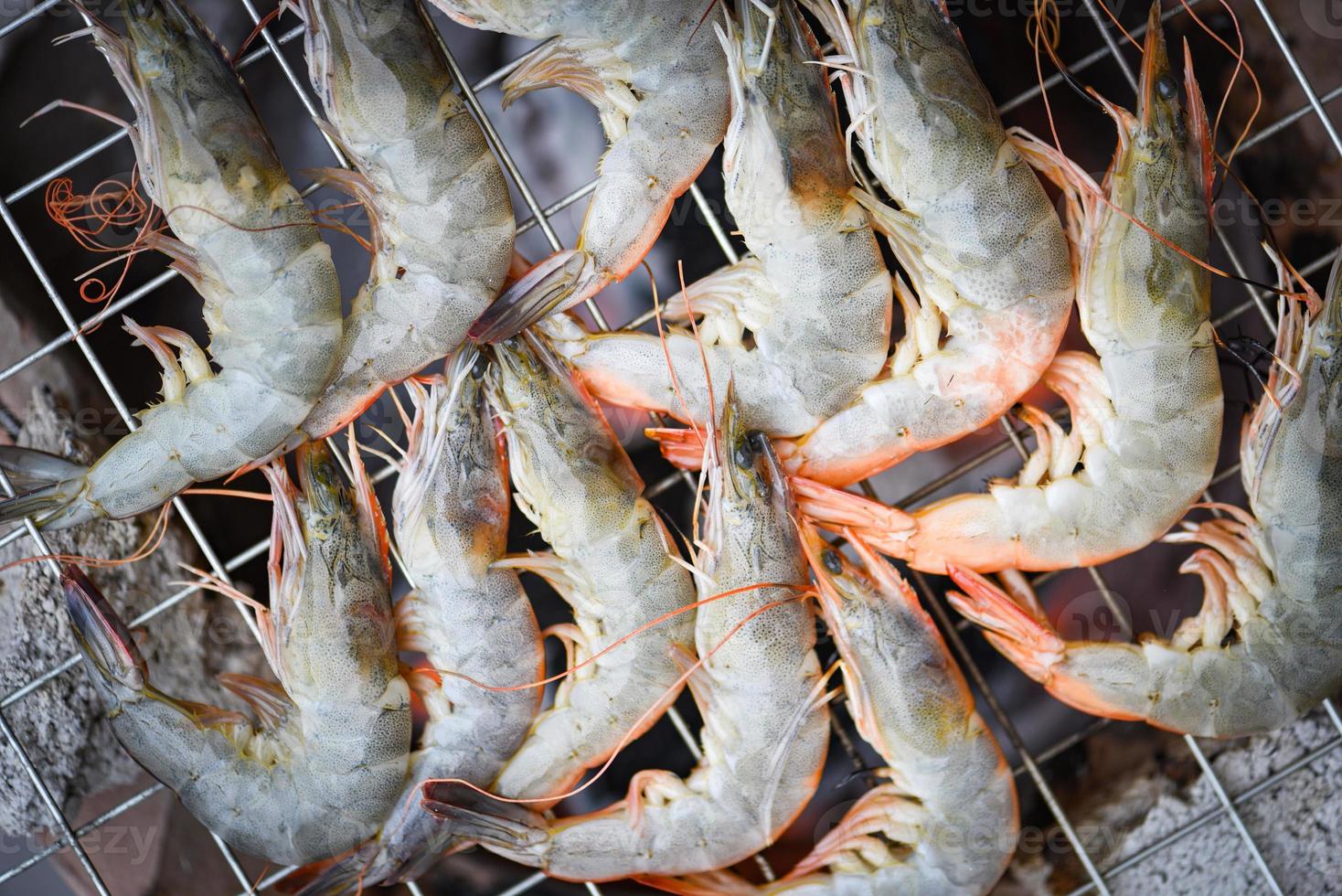 shrimp grilled bbq seafood on stove - cooked prawns shrimps burnt on grill barbecue photo