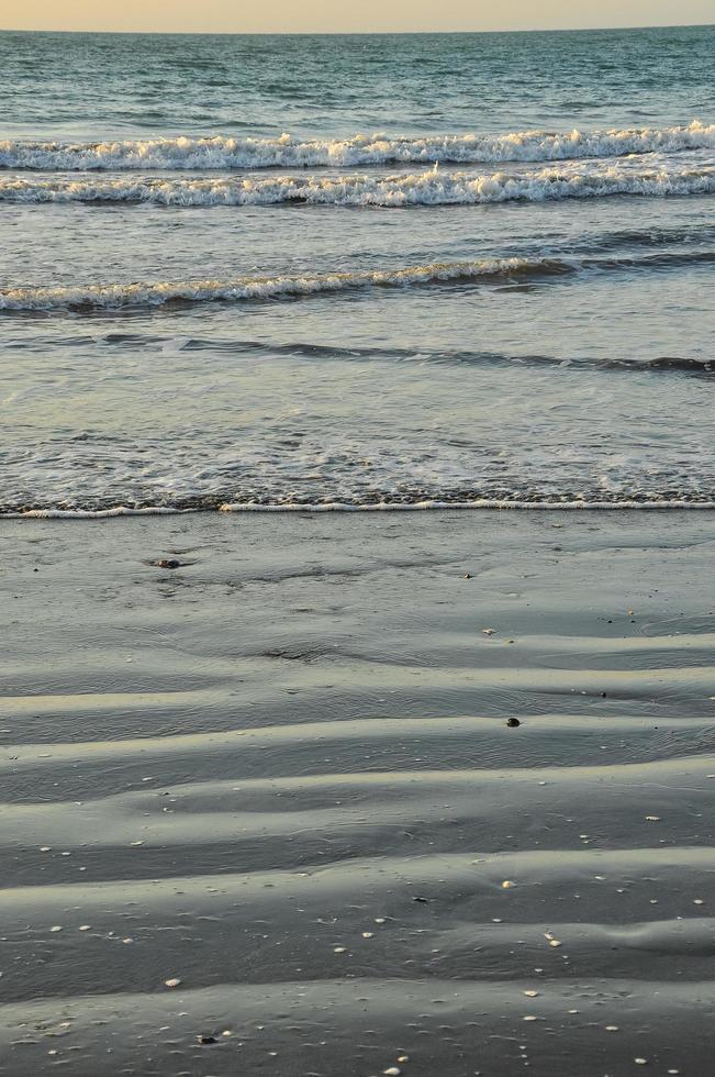 The beach at sunset photo