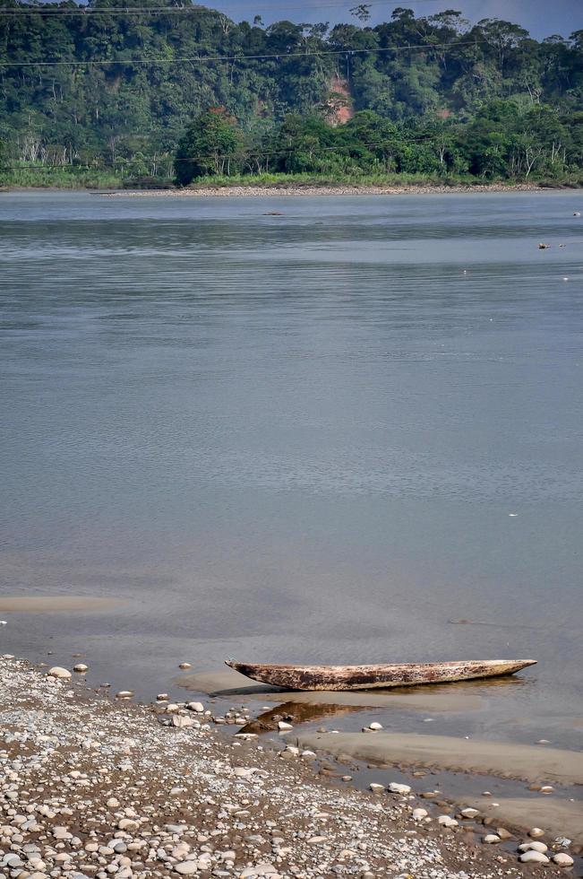 A wooden canoe on the river bank photo