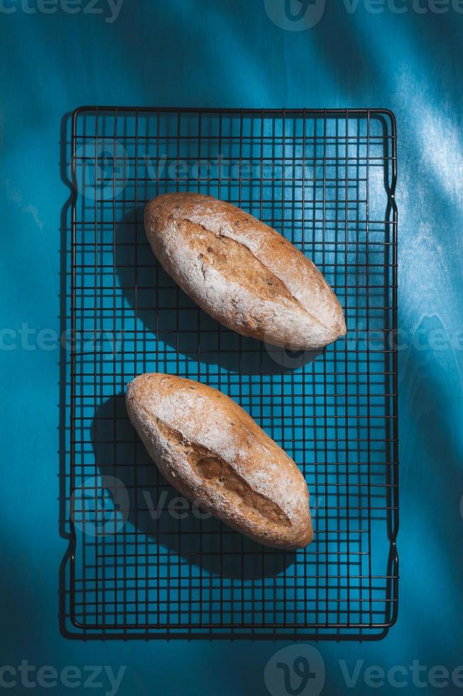 baguette on blue wood table photo
