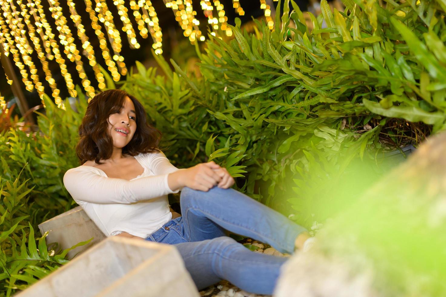 Asian female portrait with lights at night photo