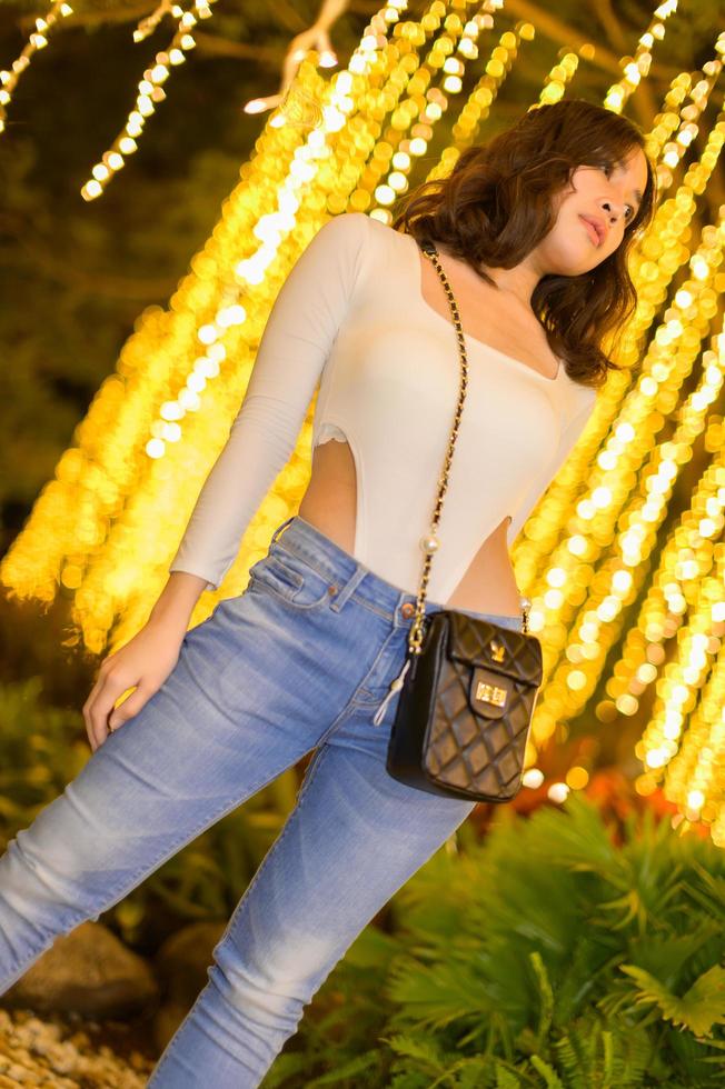 Asian female portrait with lights at night photo