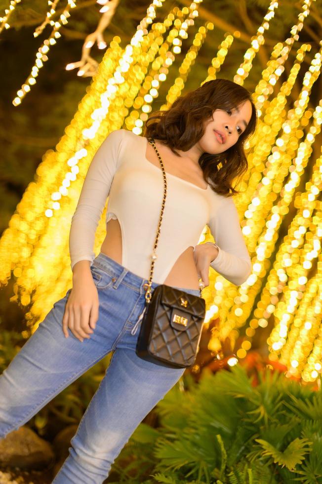 Asian female portrait with lights at night photo