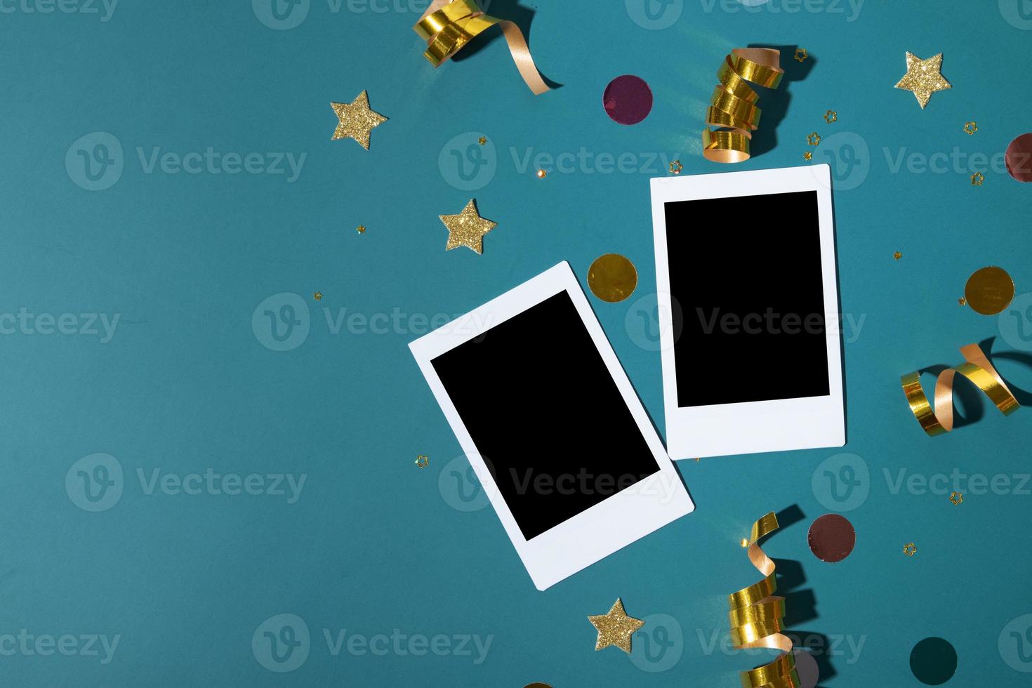 Mock up blank photos with christmas or new year shiny festive background with stars, streamers, sparkles