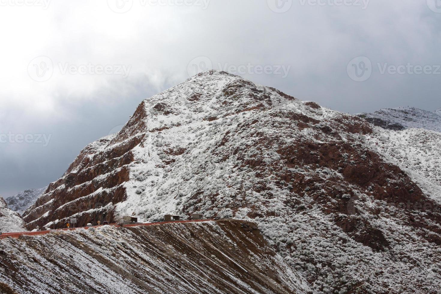 Franklin Mountains on the Westside of El Paso, Texas, covered in snow looking towards Trans Mountain Road photo