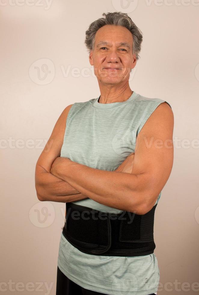 Man wearing a Back Brace for his injured back, Back Pain treatment photo