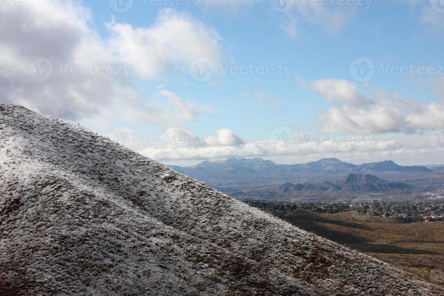 Franklin Mountains on the Westside of El Paso, Texas, covered in snow looking towards Trans Mountain Road photo