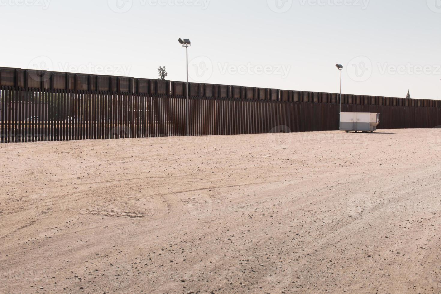 Fence along the US, Mexican border in El Paso, Texas photo