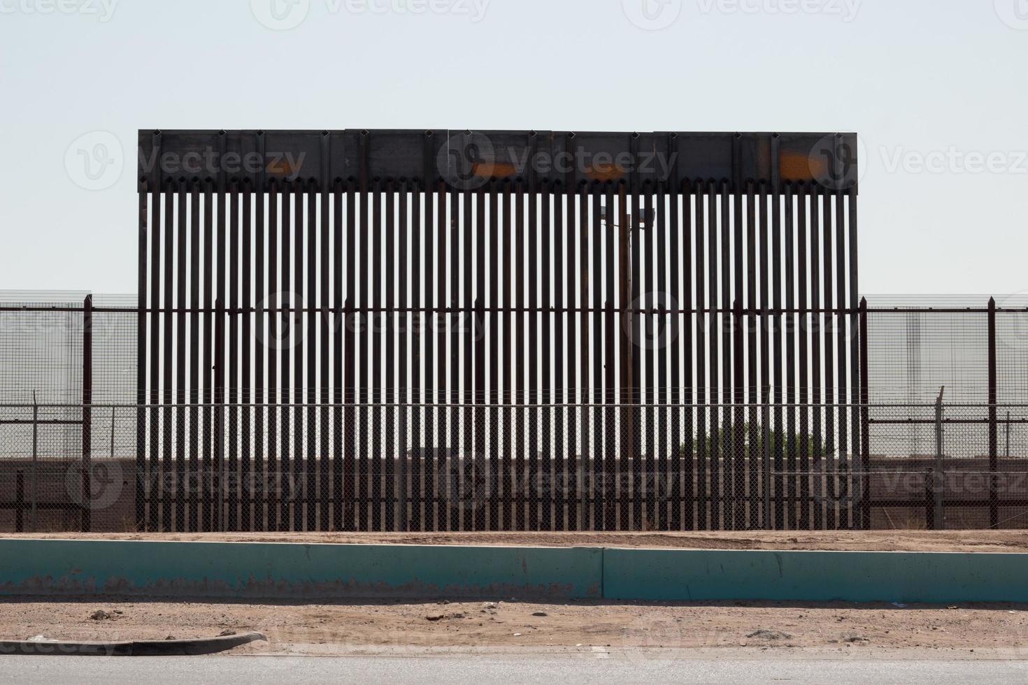 Fence along the US, Mexican border in El Paso, Texas photo