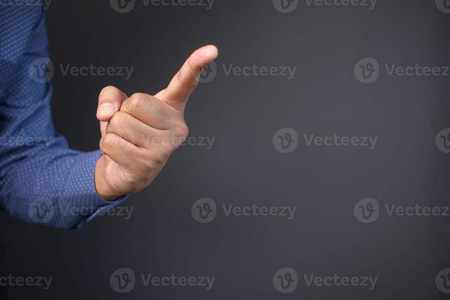 young businessman in suit point finger at camera, photo