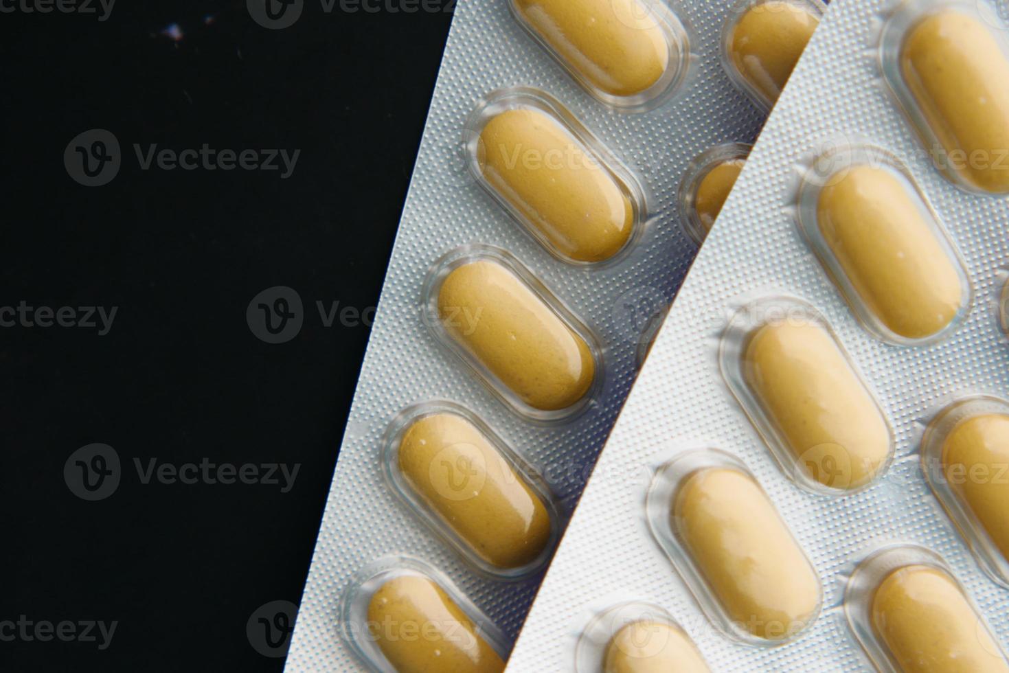 Close up of pills of blister pack on table photo