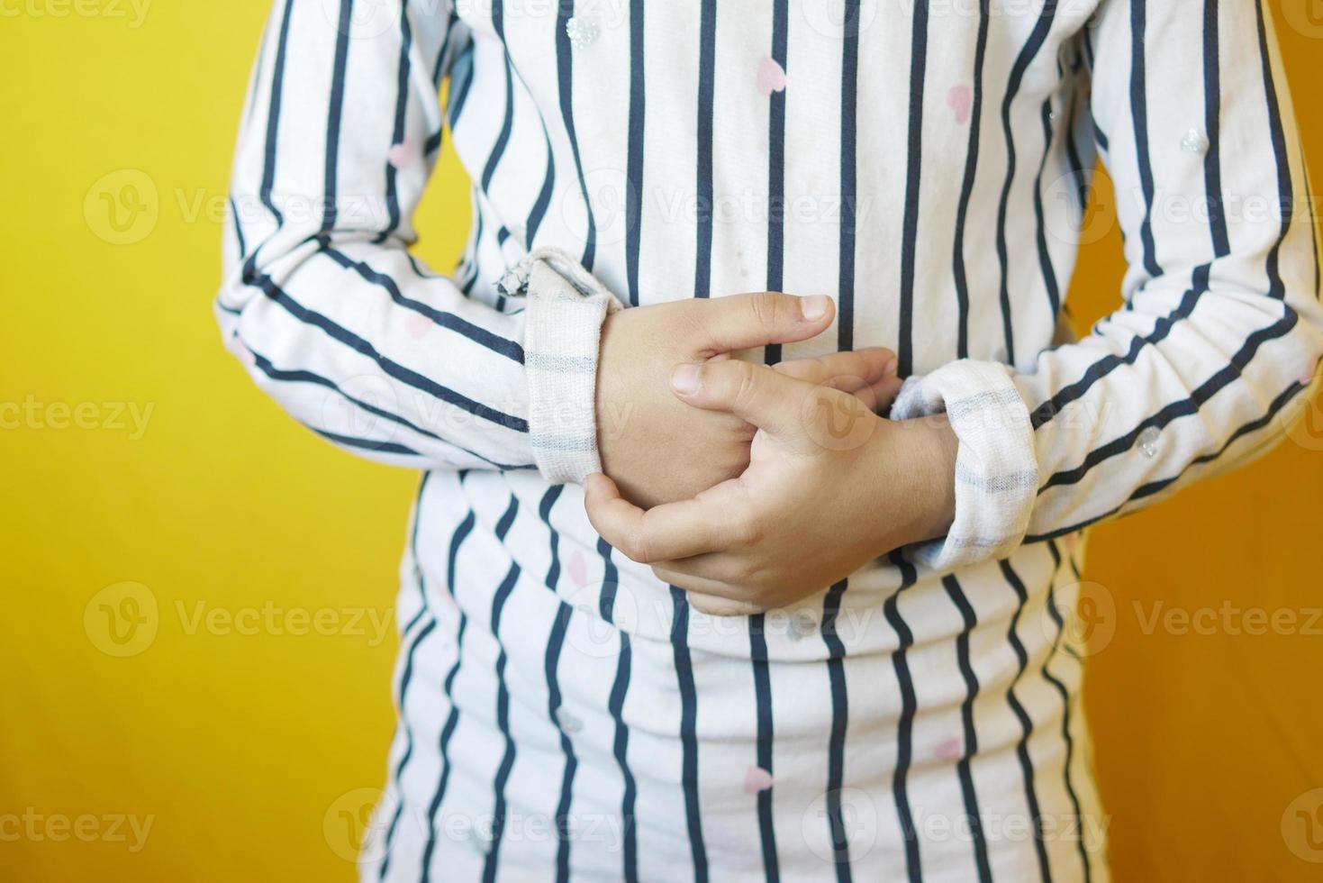 child girl suffering stomach pain close up. photo