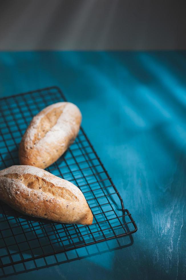 baguette on blue wood table photo