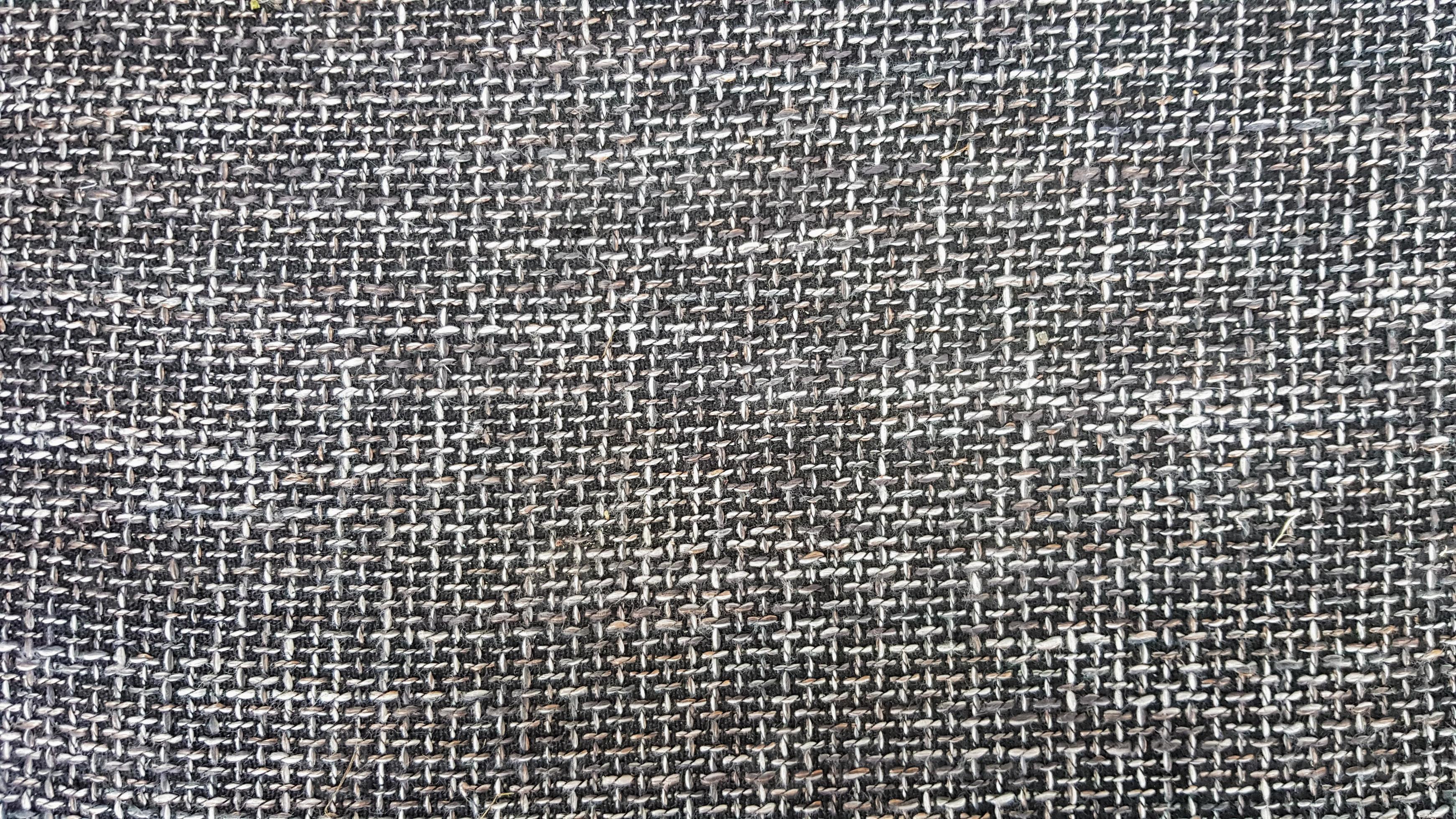 Closeup of gray fabric texture, background and wallpaper. The texture